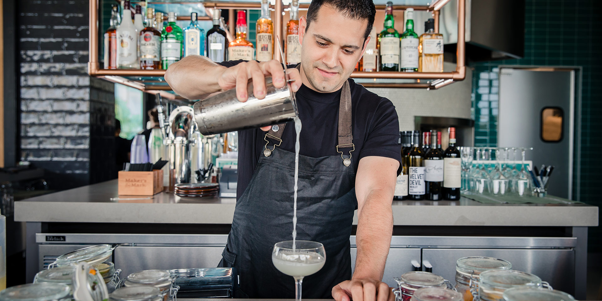 Bartender at an outdoor bar at a resort hotel