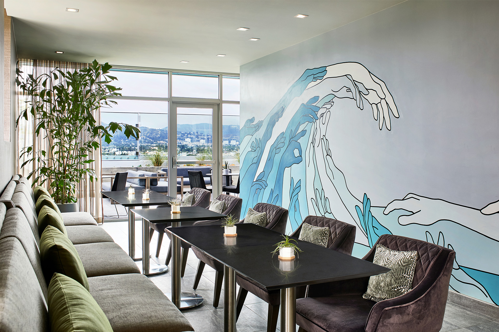 AC by Marriott Beverly Hills Rooftop lounge with sea scape mural